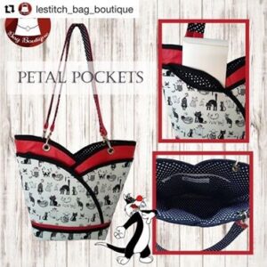 black, white and red tote bag with cat themed fabric