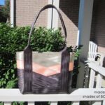 seat belt tote sitting on porch railing