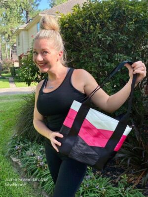 blonde women holding tote bag and smiling