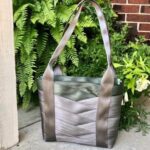 tote sewn with griege and army colored seat belts on porch