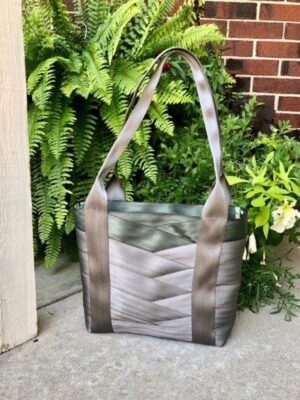 tote sewn with griege and army colored seat belts on porch