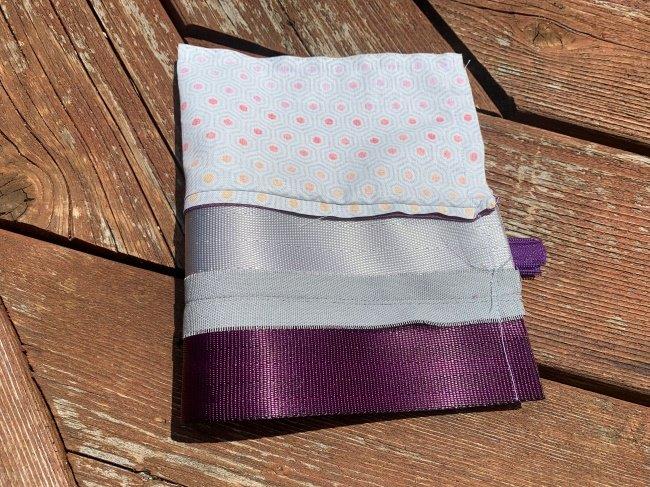 Edges of exterior and lining of pouch are stitched together around all edges