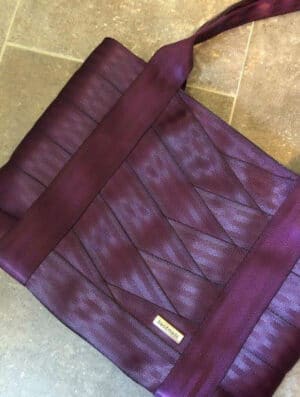 tote sewn with purple seat belt webbing